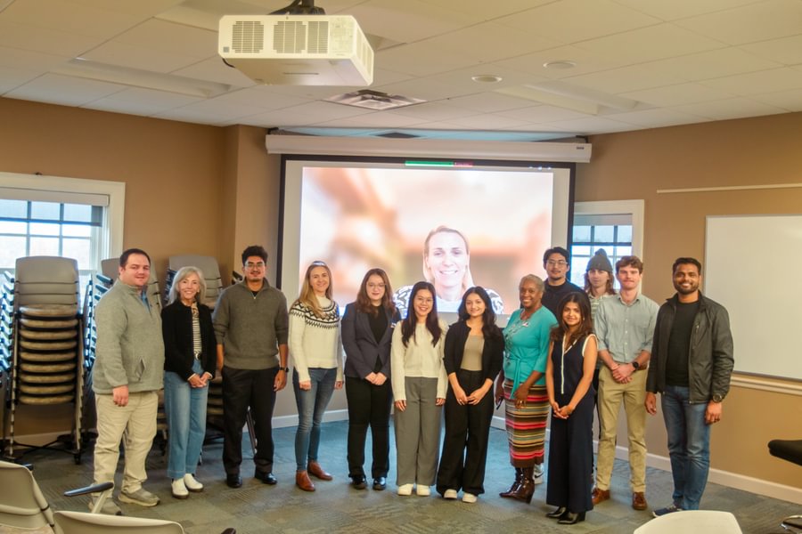 Gettysburg students pose with local business leaders after their final presentations in the Building America program.