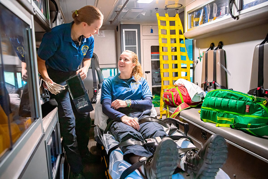 Anne Harrower ’25 and Mackenzie Szlosek ’25 demonstrating the operations of medical response