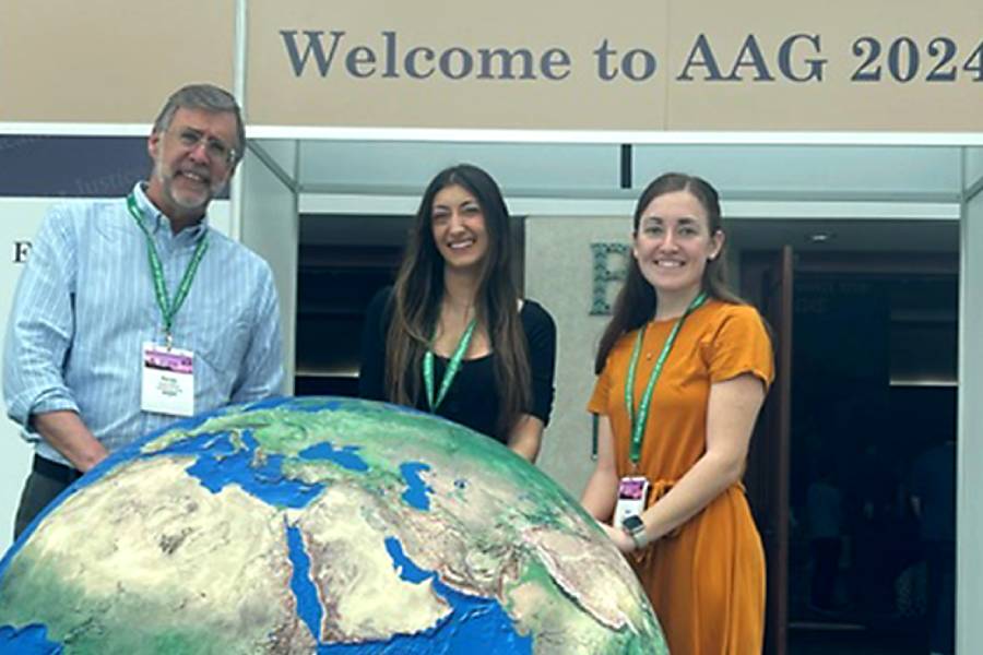 Prof. Randall Wilson, Alyssa Papantonakis '24, Molly Hoffman '24 at the AAG Conference in 2024.